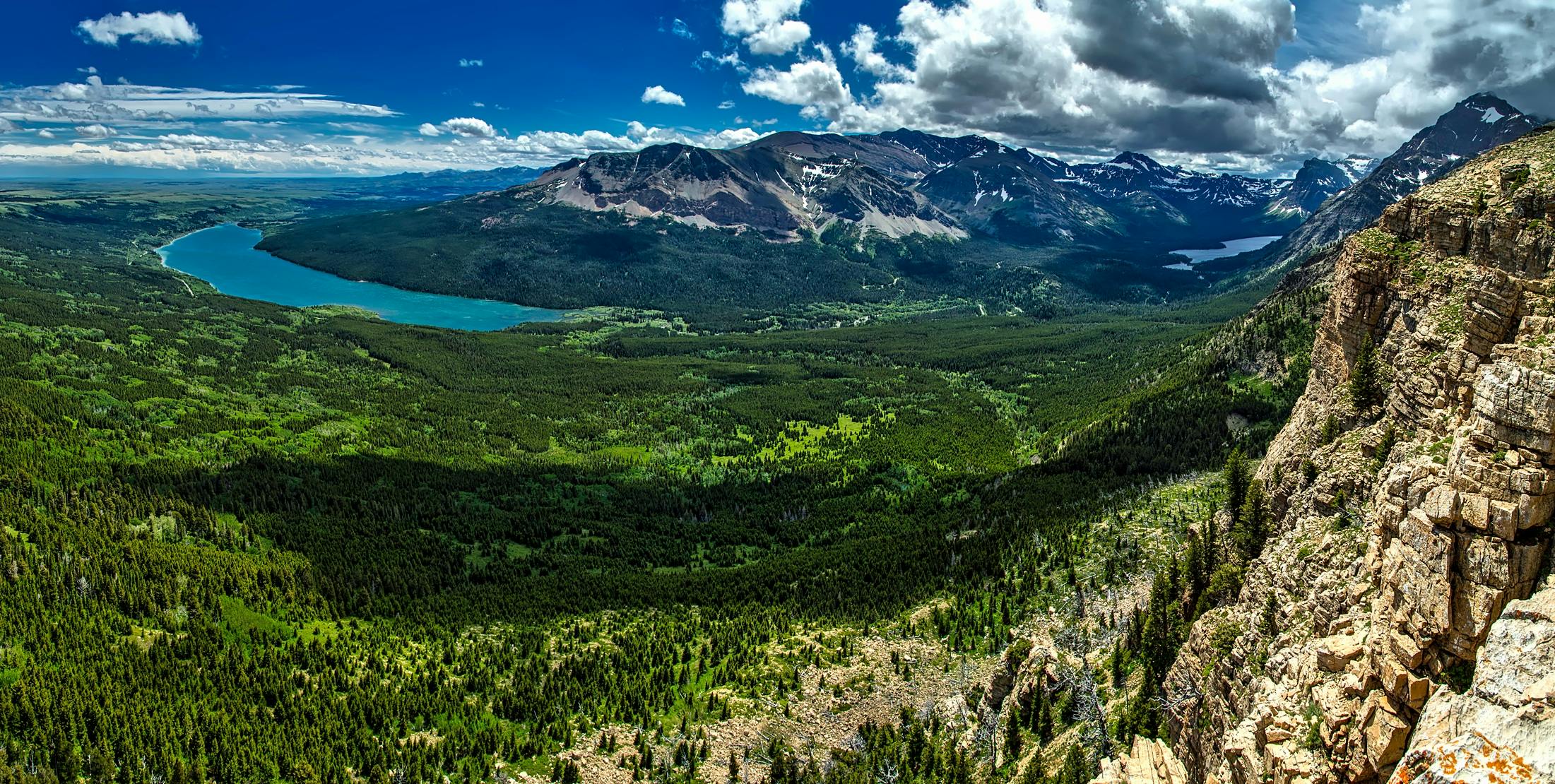 Explore the breathtaking mountains and lush valleys of Glacier National Park, captured in vivid detail.